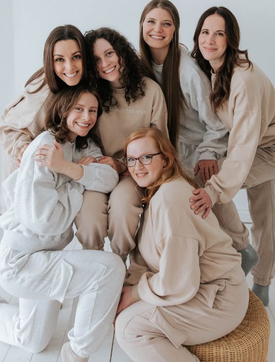 Six dancers of the company smiling together